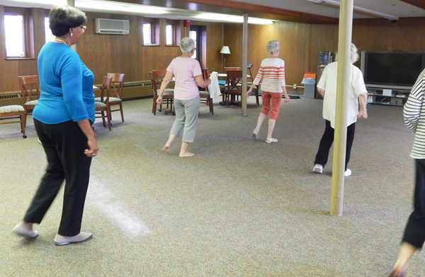 Debbie Grubbs teaches steps during "Happy Feet," a weekly line dancing class