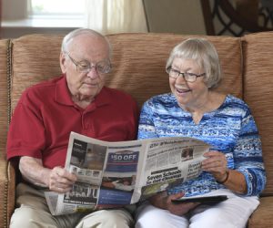 Phil and Judy Feather reading the news paper together
