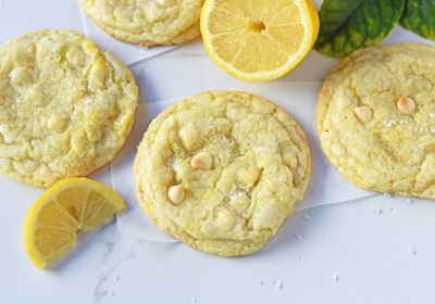 A close-up view of lemon cookies with white chocolate chips.