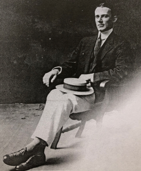 William Freeman sitting in a chair with his hat on his lap