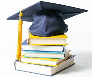 Books and a graduation cap